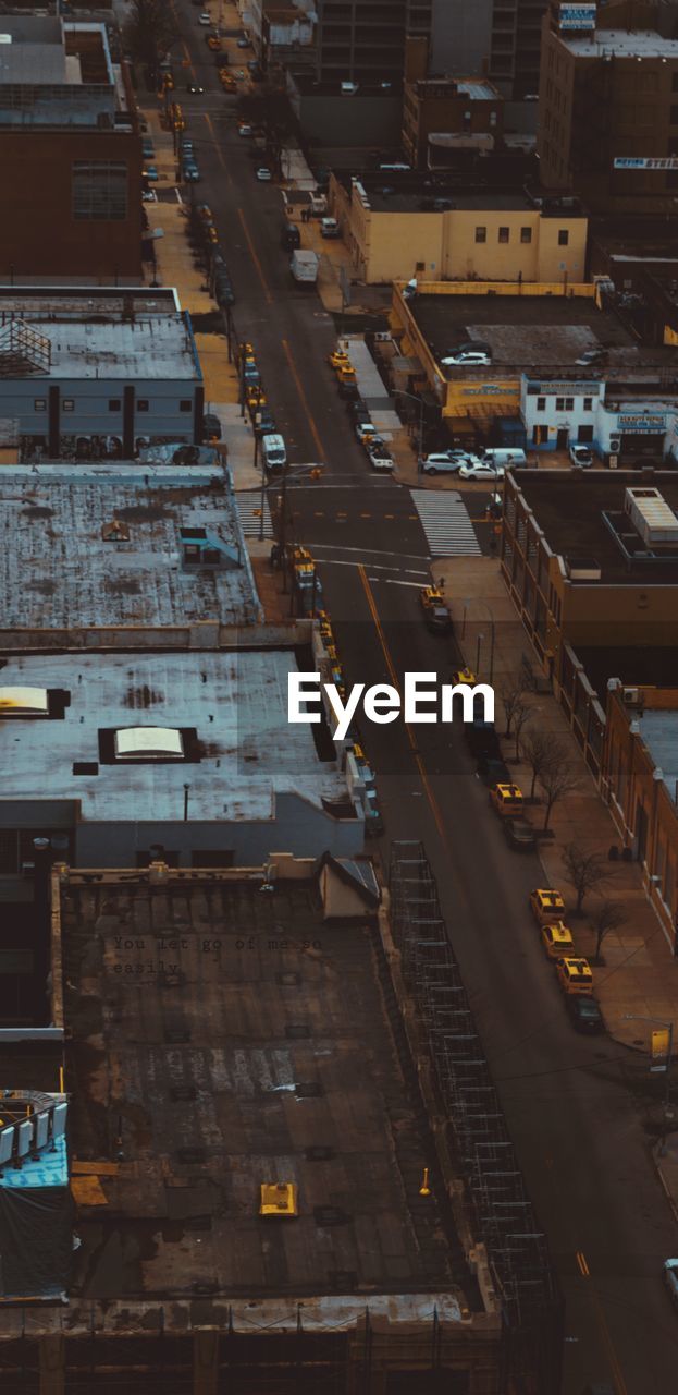 High angle view of traffic on road amidst buildings