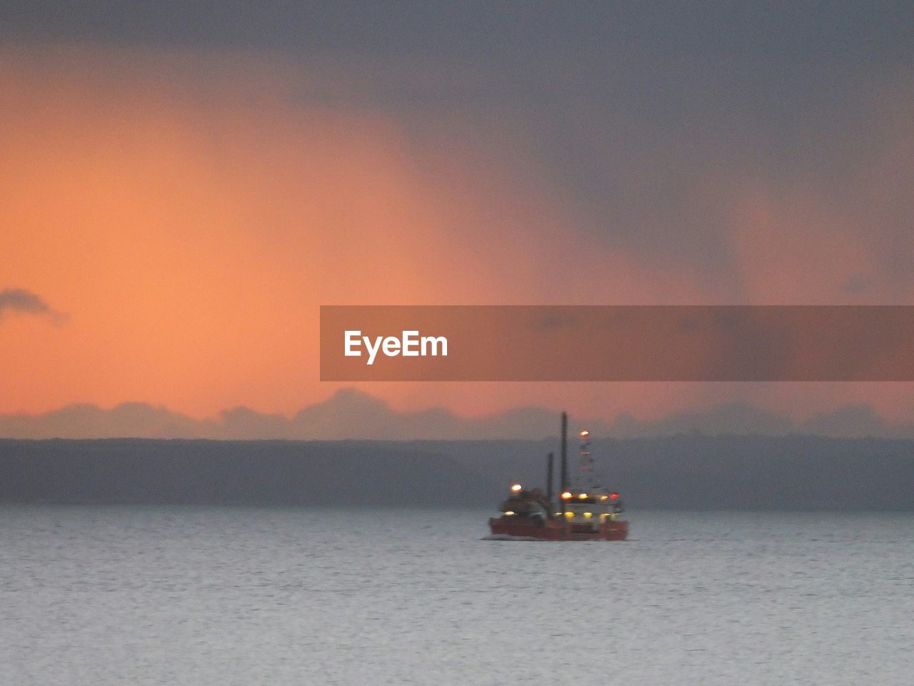 Silhouette of boats at sunset