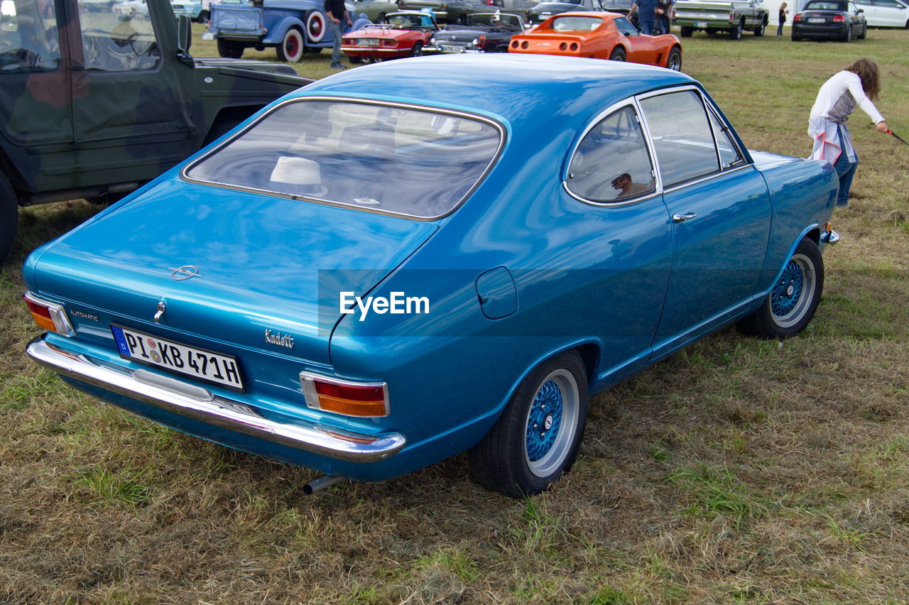 CAR ON BLUE TRUCK