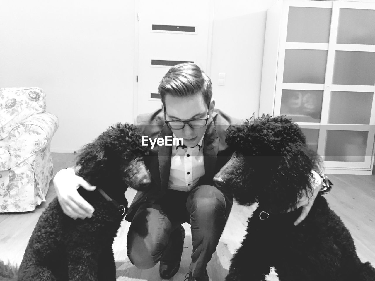 Young man with dogs at home