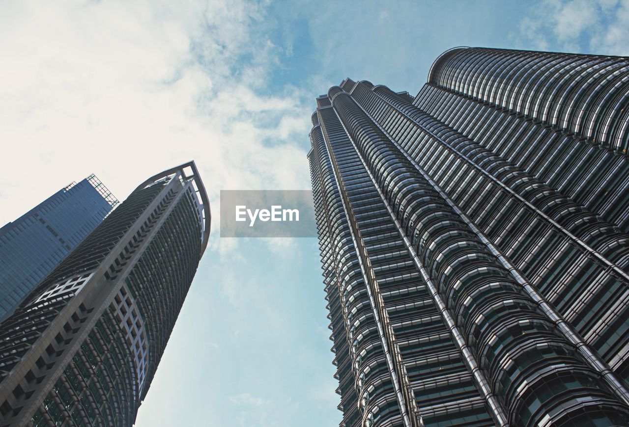 Low angle view of modern buildings against sky