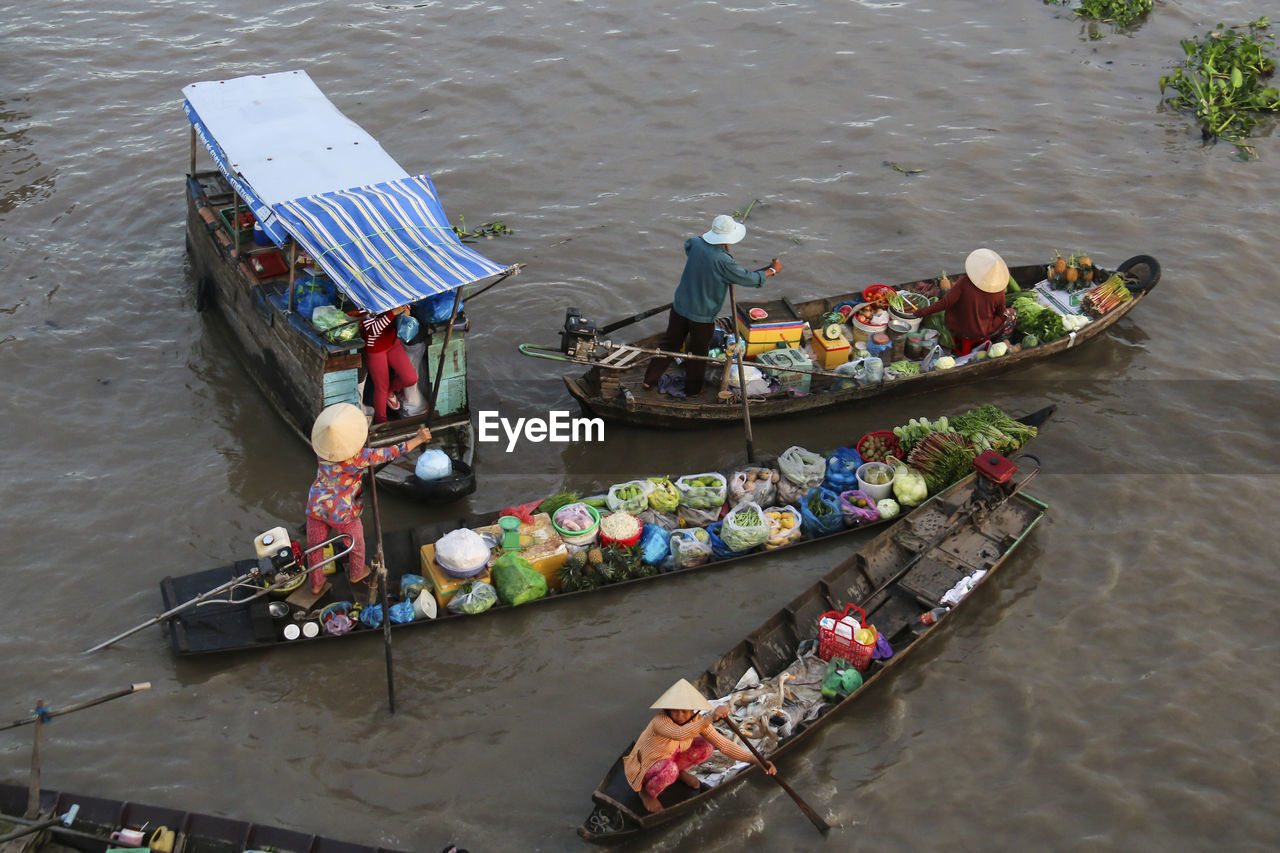 High angle view of people selling food in boat