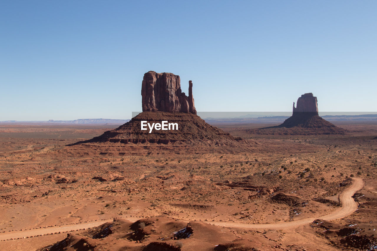 Rock formations in desert against clear sky