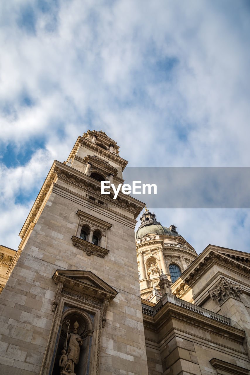 Low angle view of cathedral against cloudy sky