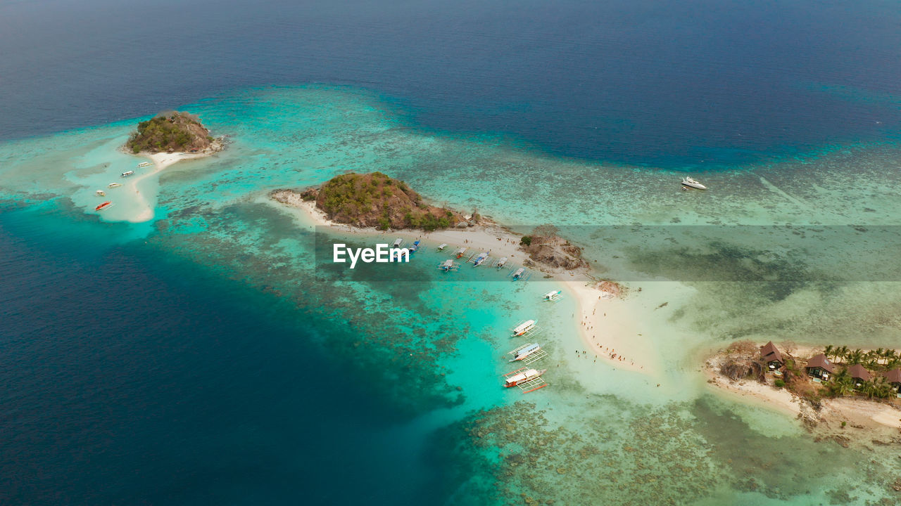 Aerial view tropical island with sand white beach. bulog dos, philippines, palawan. 