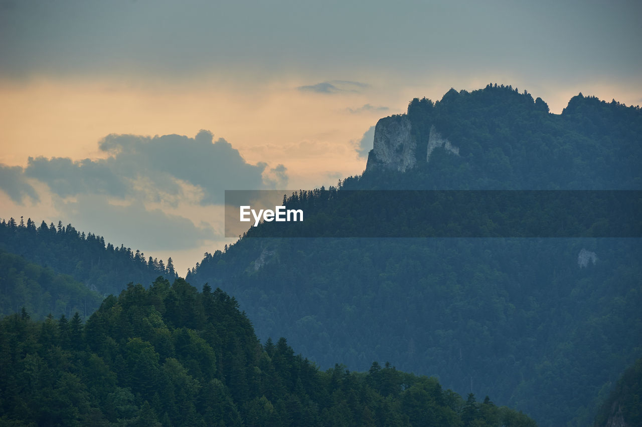 Scenic view of mountains against sky at sunset