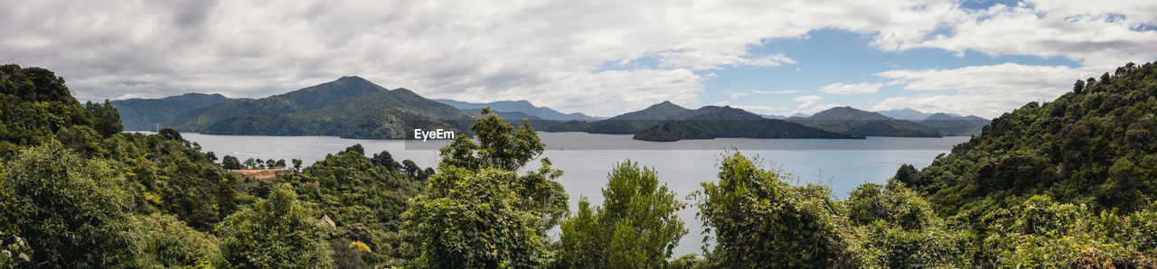 Panoramic view of plants and mountains against sky