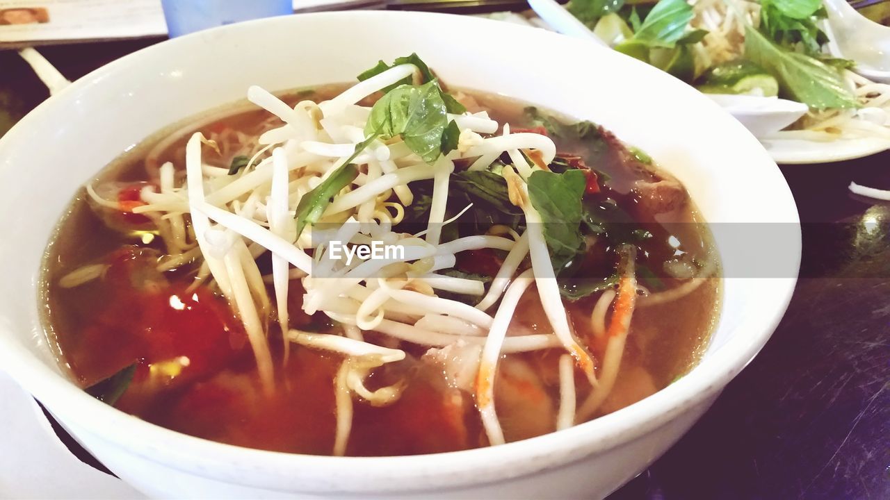 High angle view of pho soup served in bowl
