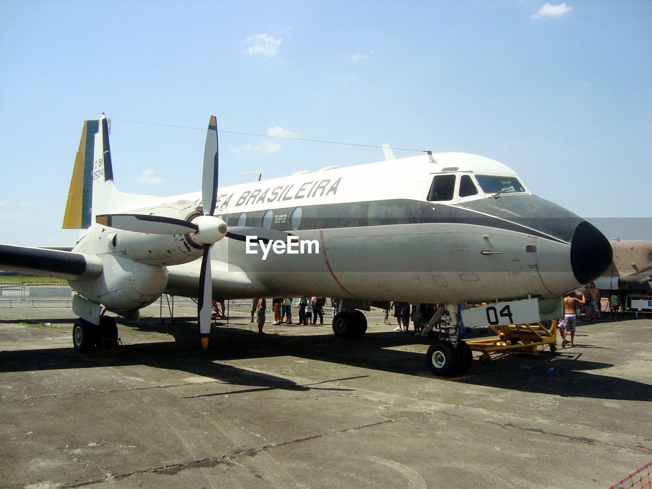 AIRPLANE ON RUNWAY AGAINST SKY