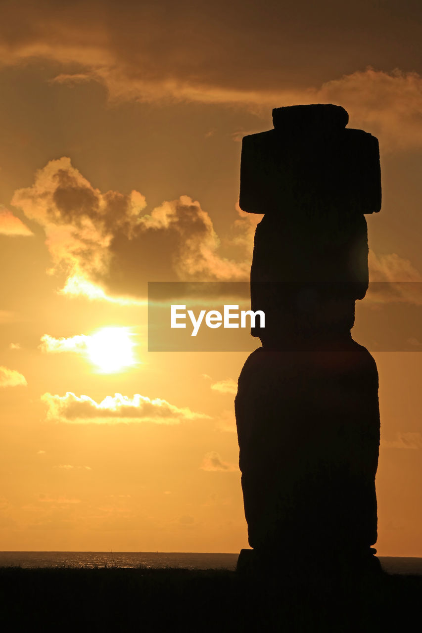 STATUE AGAINST SKY DURING SUNSET