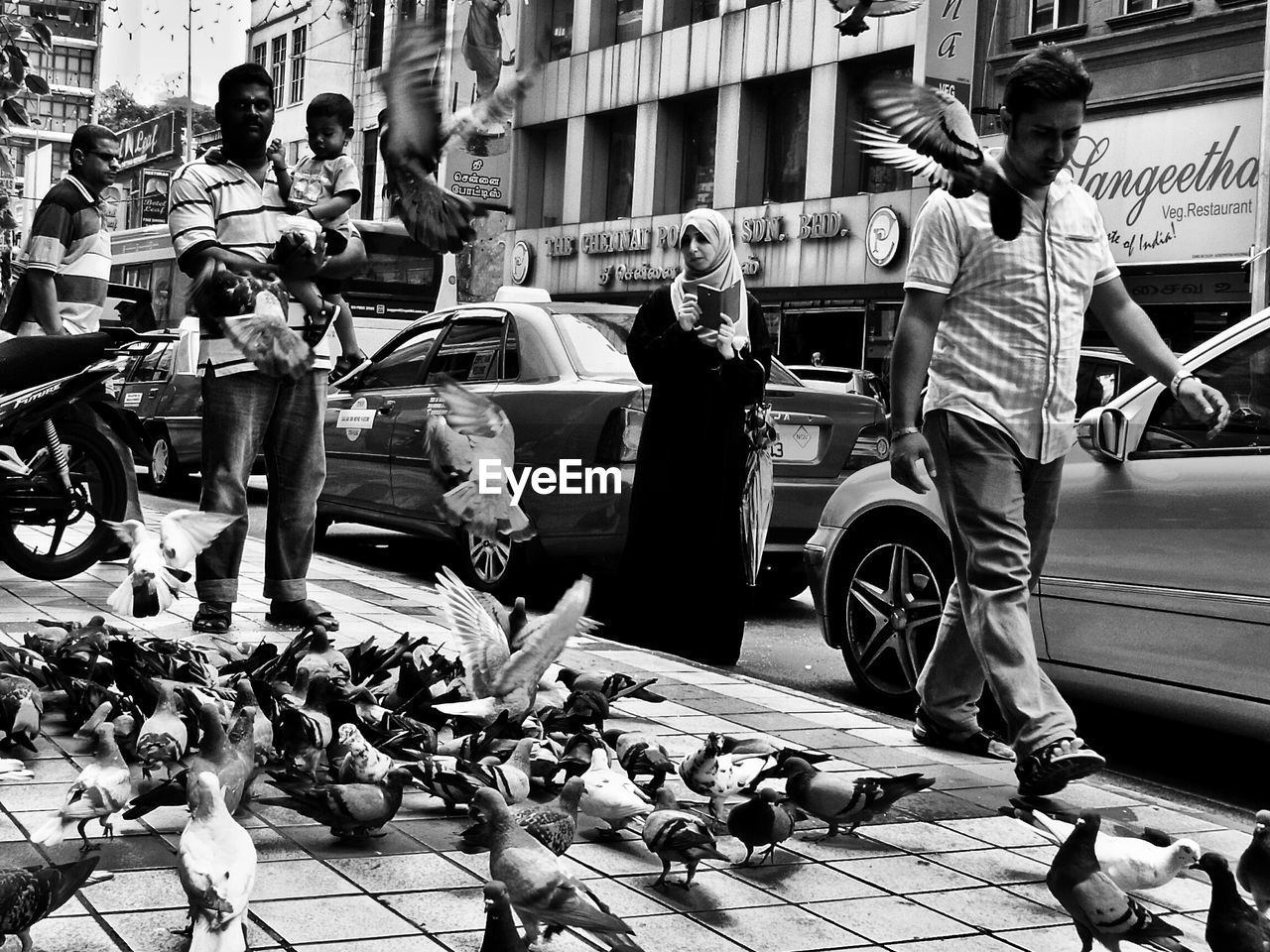 PEOPLE STANDING IN MARKET