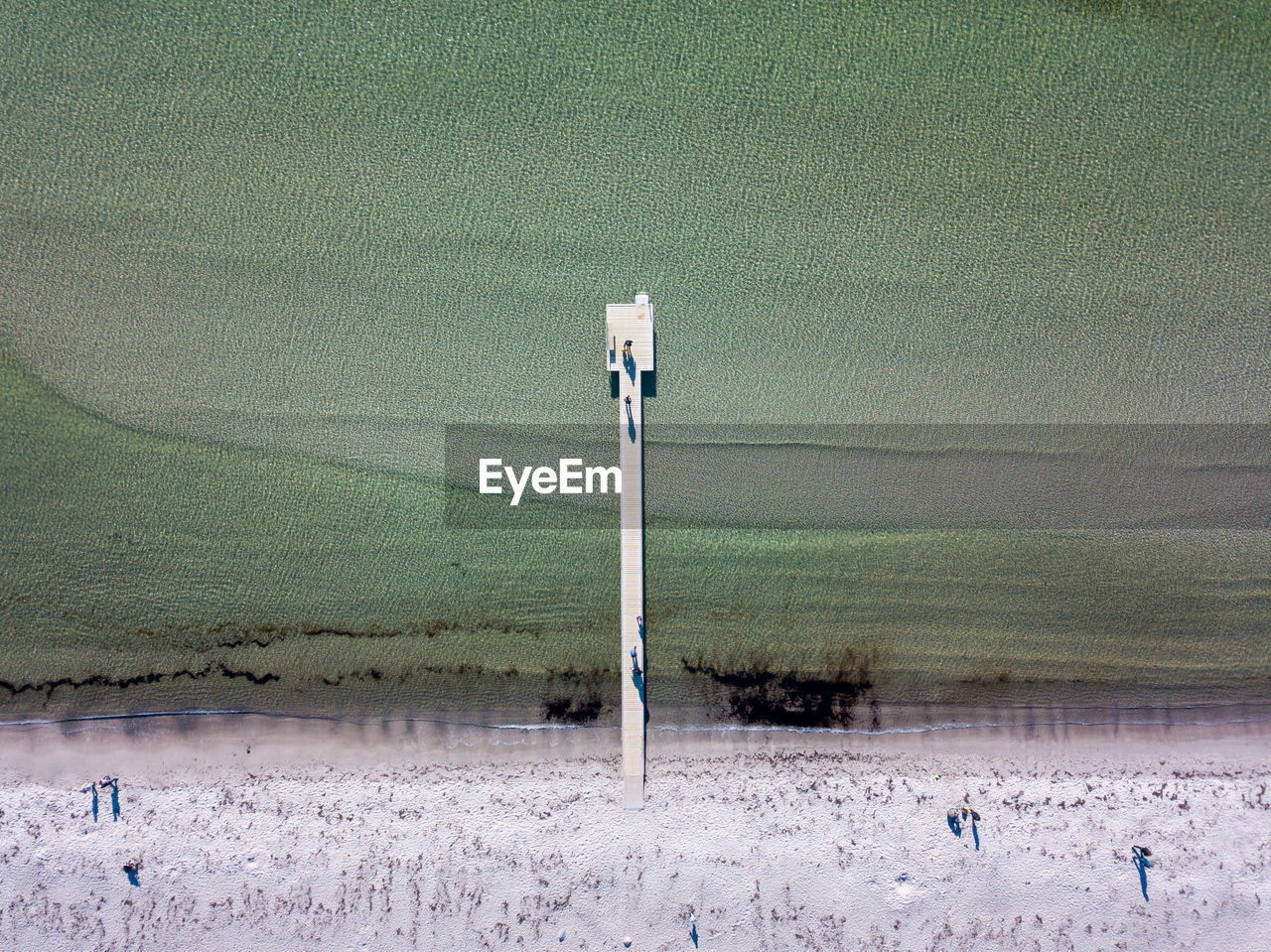 HIGH ANGLE VIEW OF POLE ON BEACH