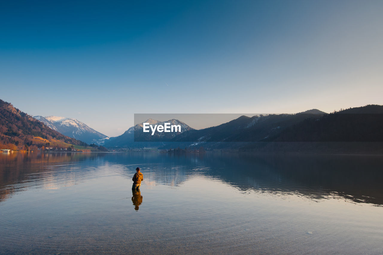 Man standing in lake