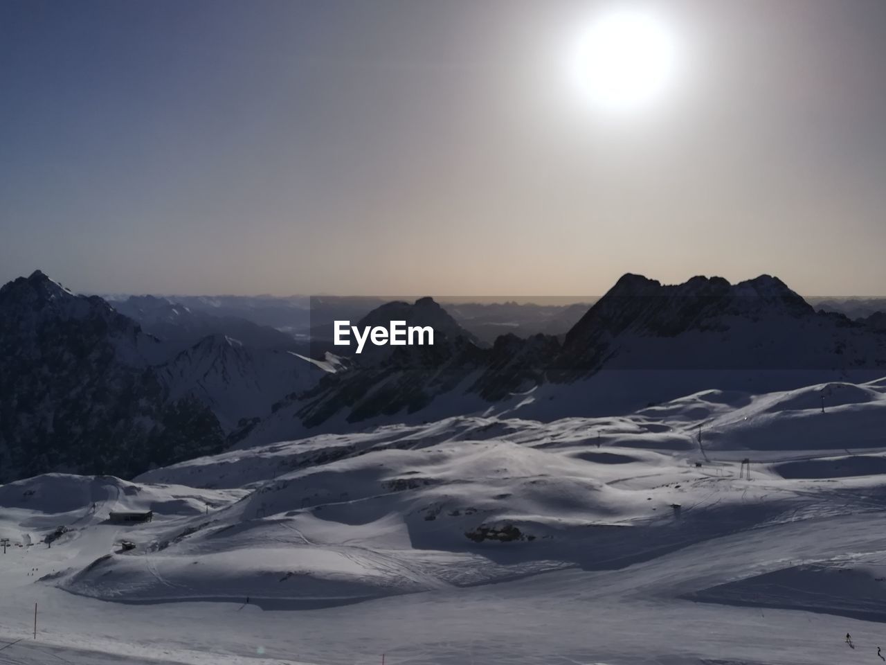 Scenic view of snowcapped mountains against clear sky