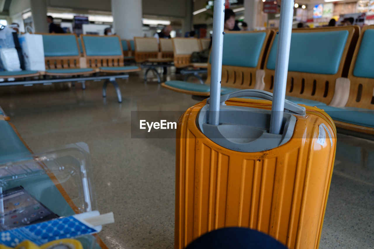 Close-up of wheeled luggage at airport