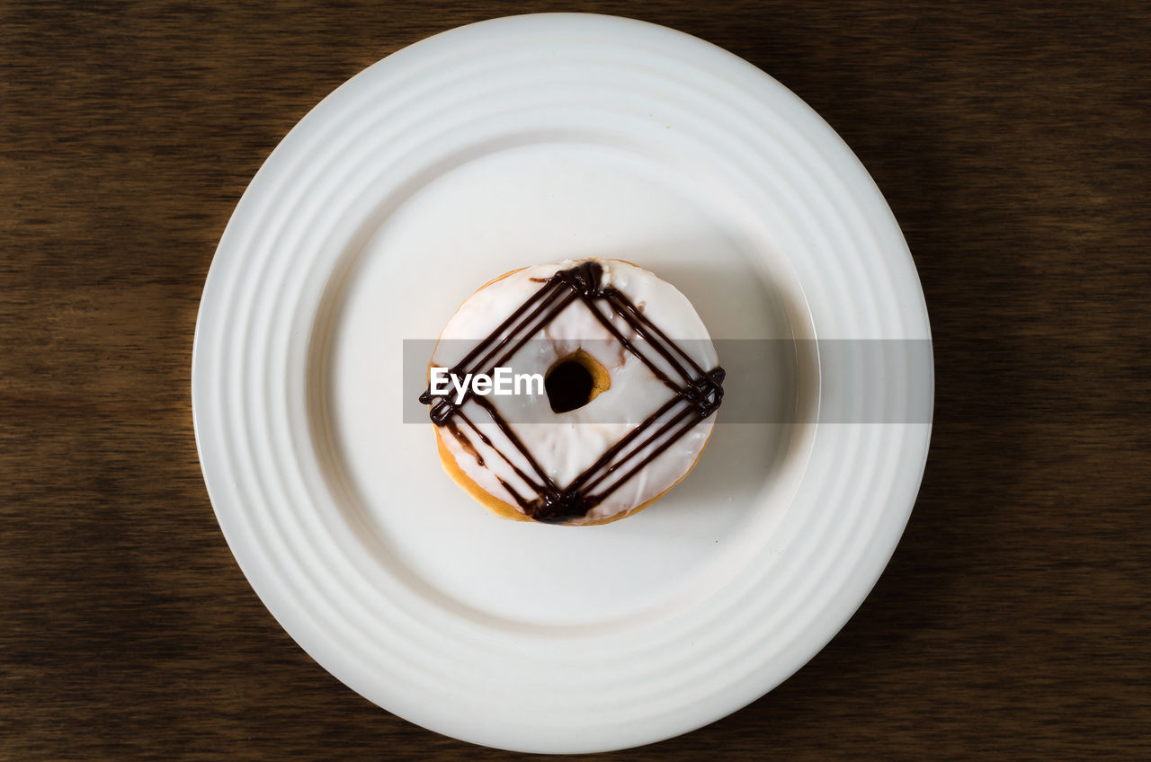 Directly above shot of donut in plate on table
