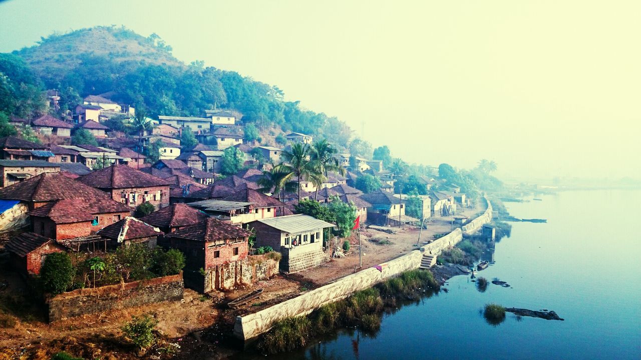 HIGH ANGLE VIEW OF TOWN BY SEA