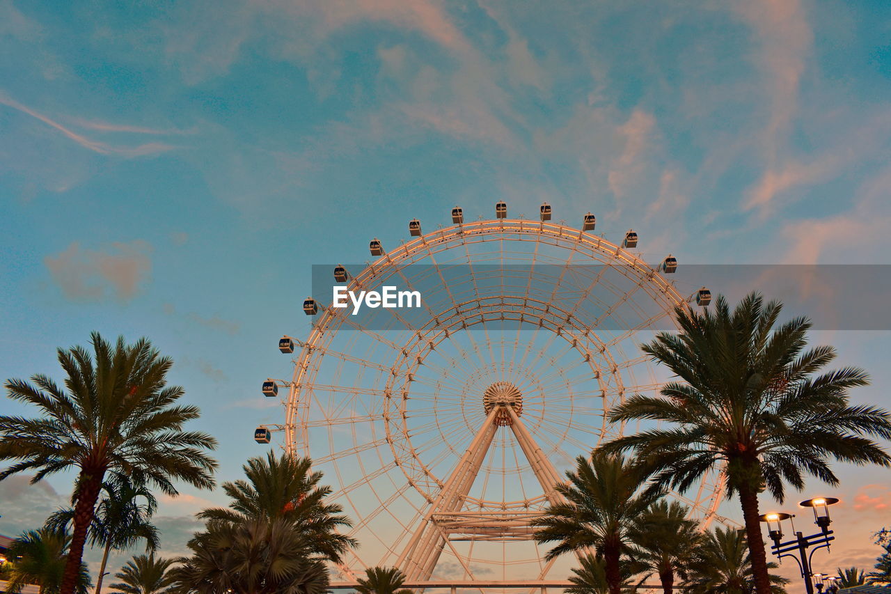 LOW ANGLE VIEW OF AMUSEMENT PARK RIDE AGAINST SKY