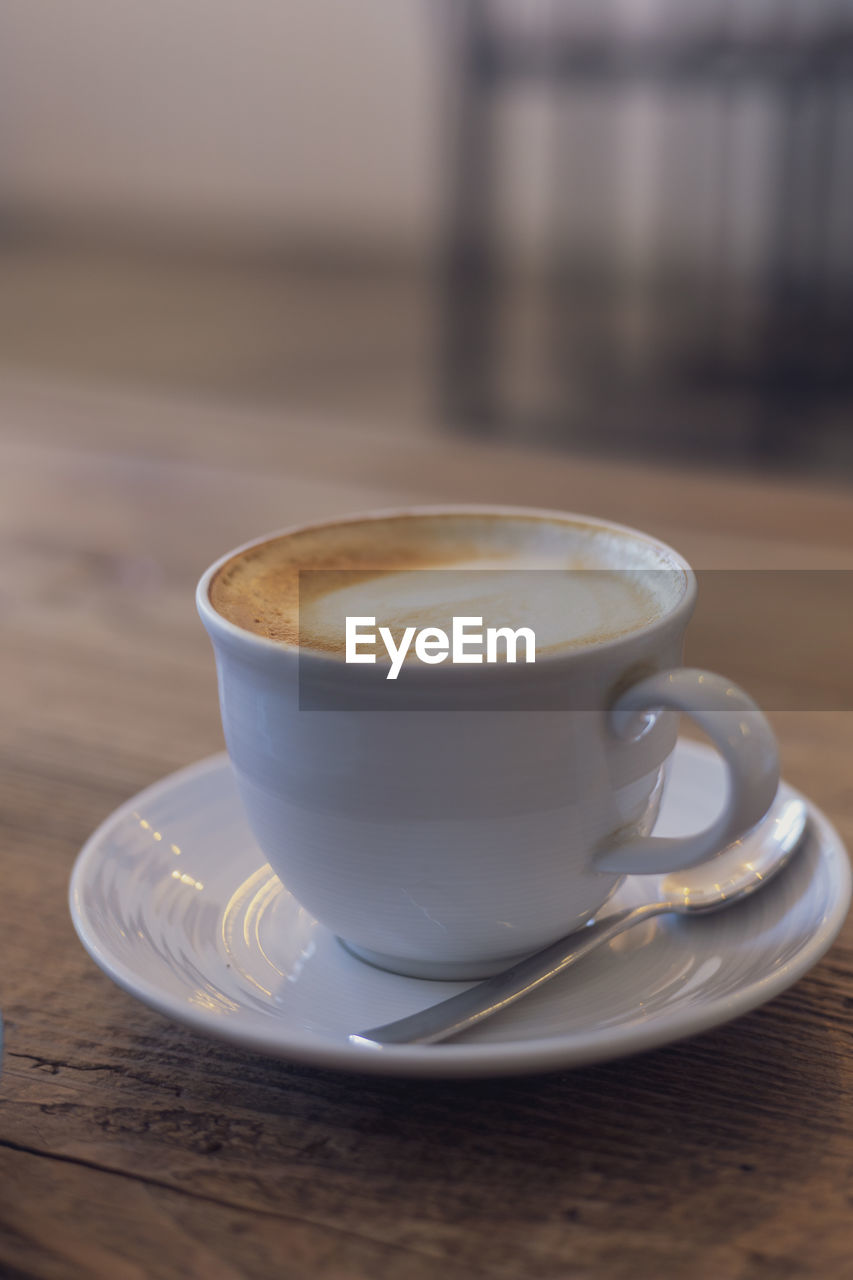 close-up of coffee cup on table