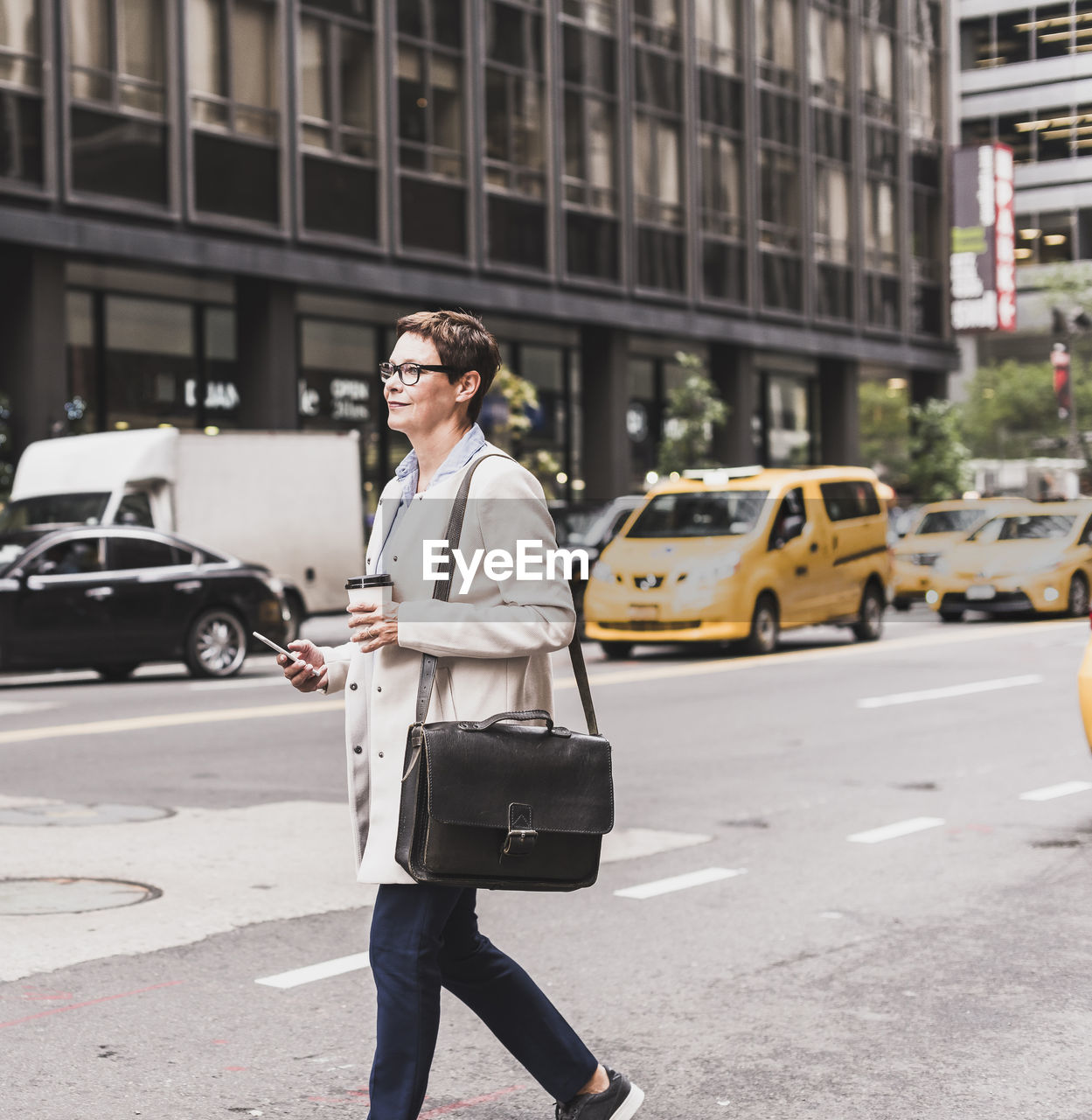 Usa, new york city, woman in manhattan on the go