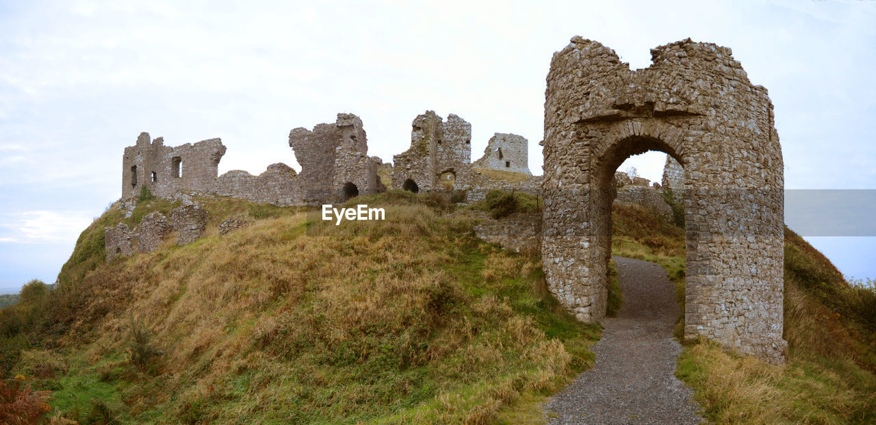 Low angle view of dunamase ruins on hill against sky