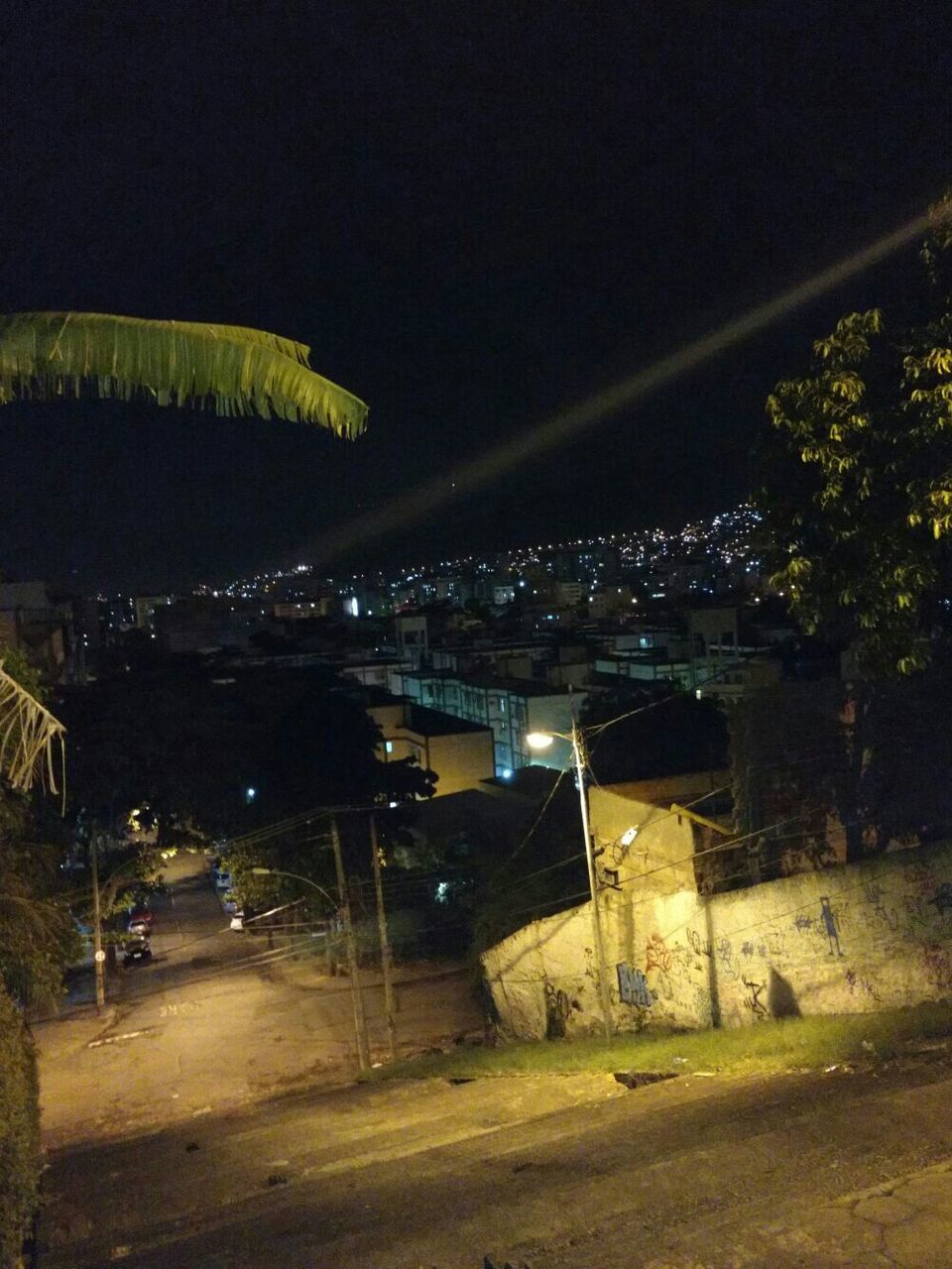 ILLUMINATED ROAD AGAINST SKY