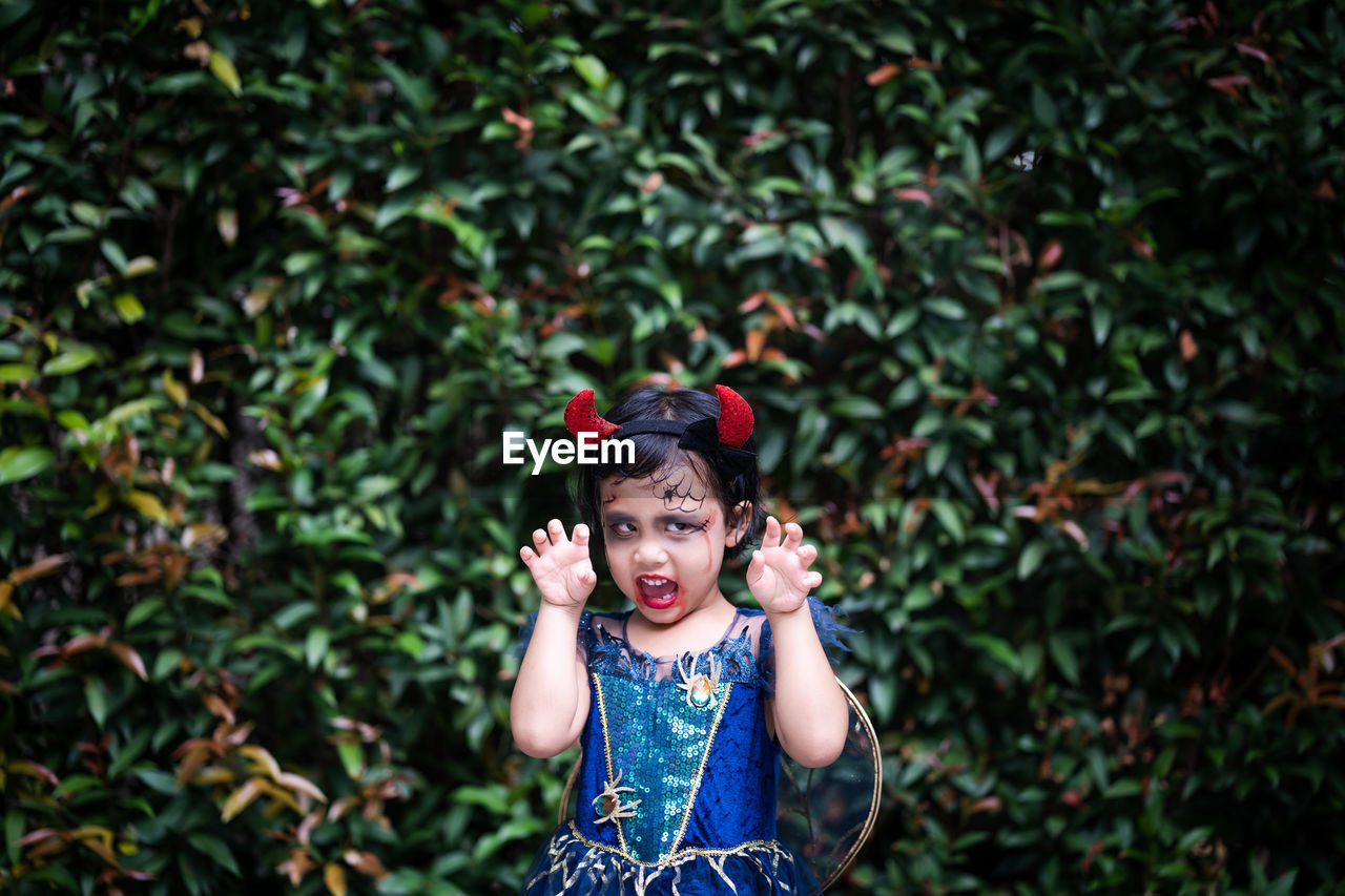 Portrait of cute girl in halloween costume.