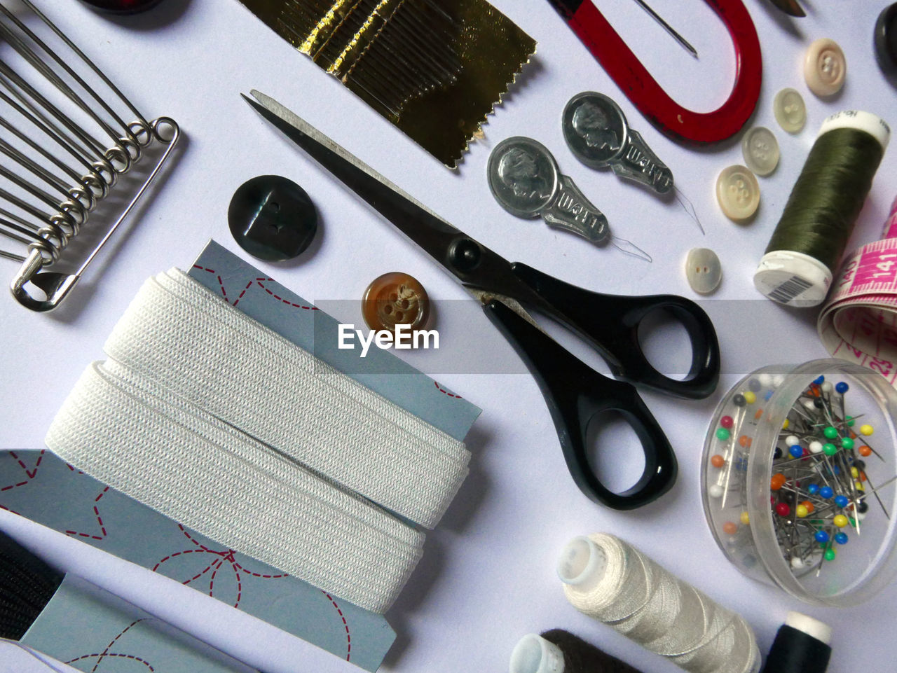 High angle view of sewing kit arranged on table