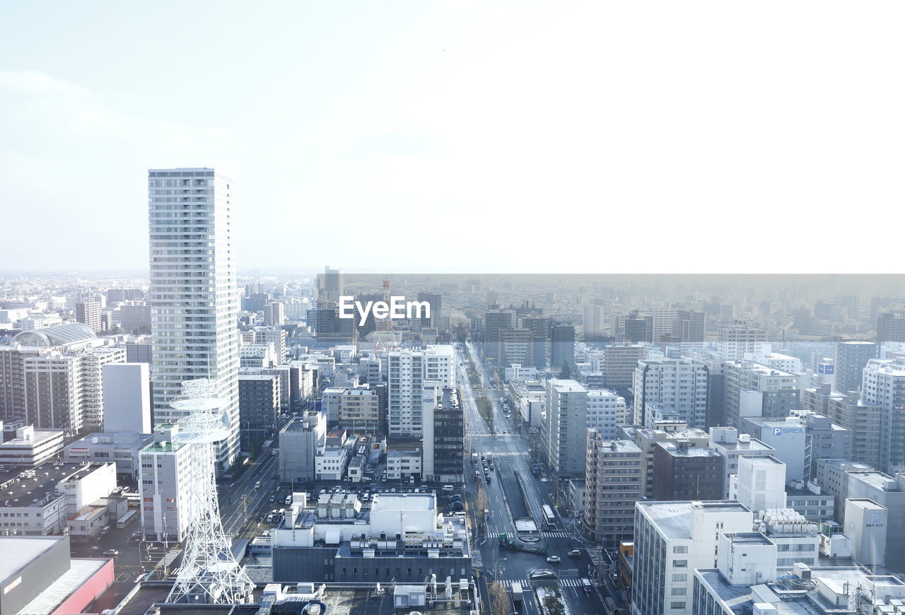 Aerial view of cityscape against sky