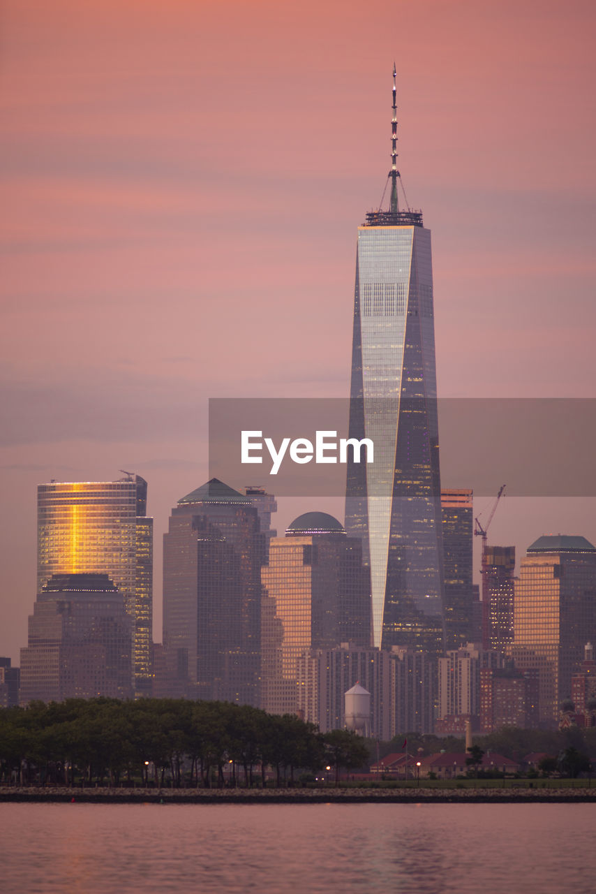 MODERN BUILDINGS IN CITY DURING SUNSET