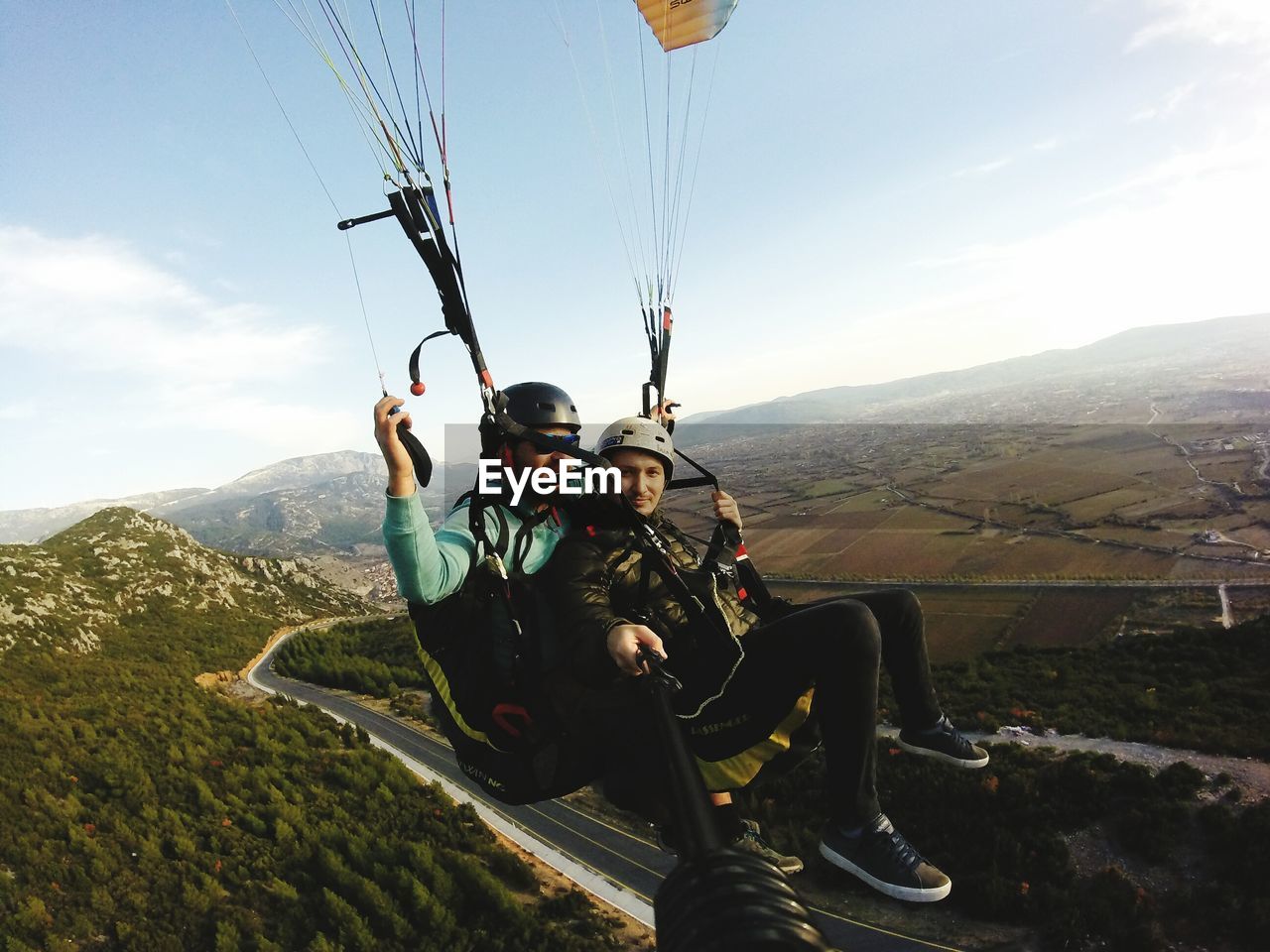 HIGH ANGLE VIEW OF OVERHEAD CABLE CAR ON MOUNTAIN