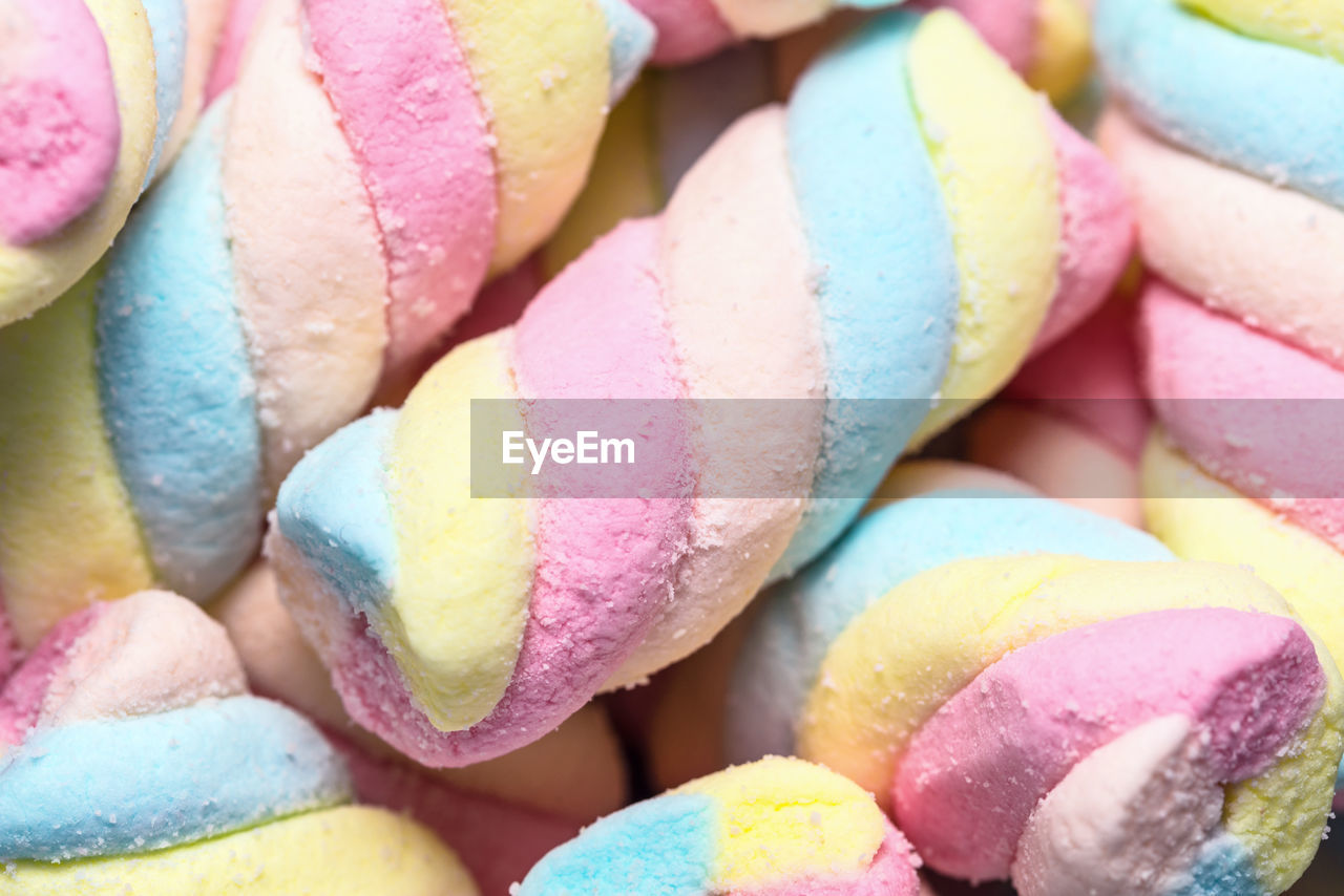 Background of twisted, colorful marshmallow, close up, macro