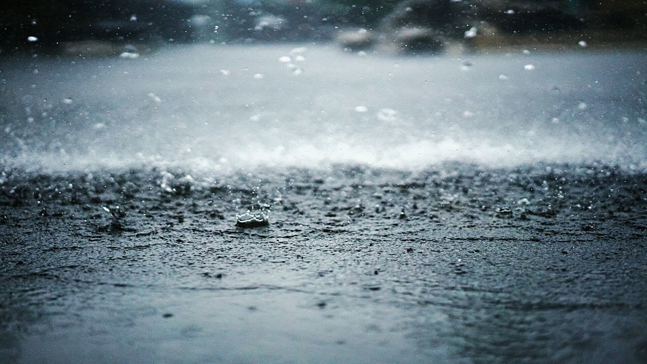 Rain splashing on street