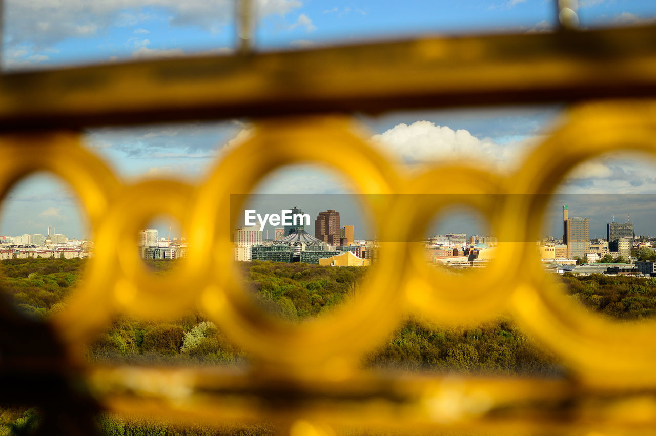 TILT-SHIFT IMAGE OF CITY IN BACKGROUND