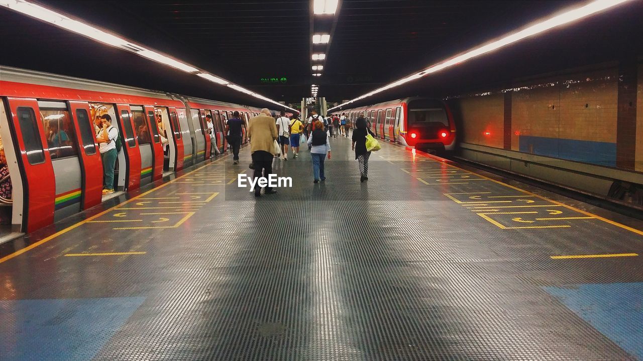 People walking at subway station platform