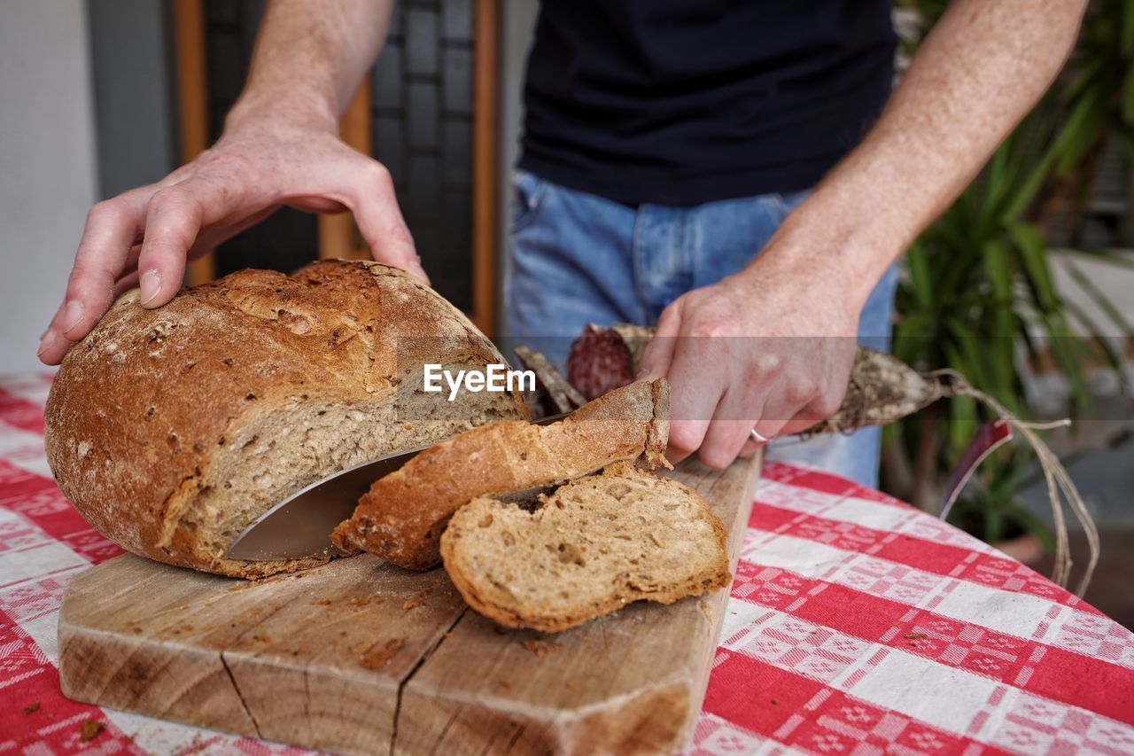 Close-up of man preparing food