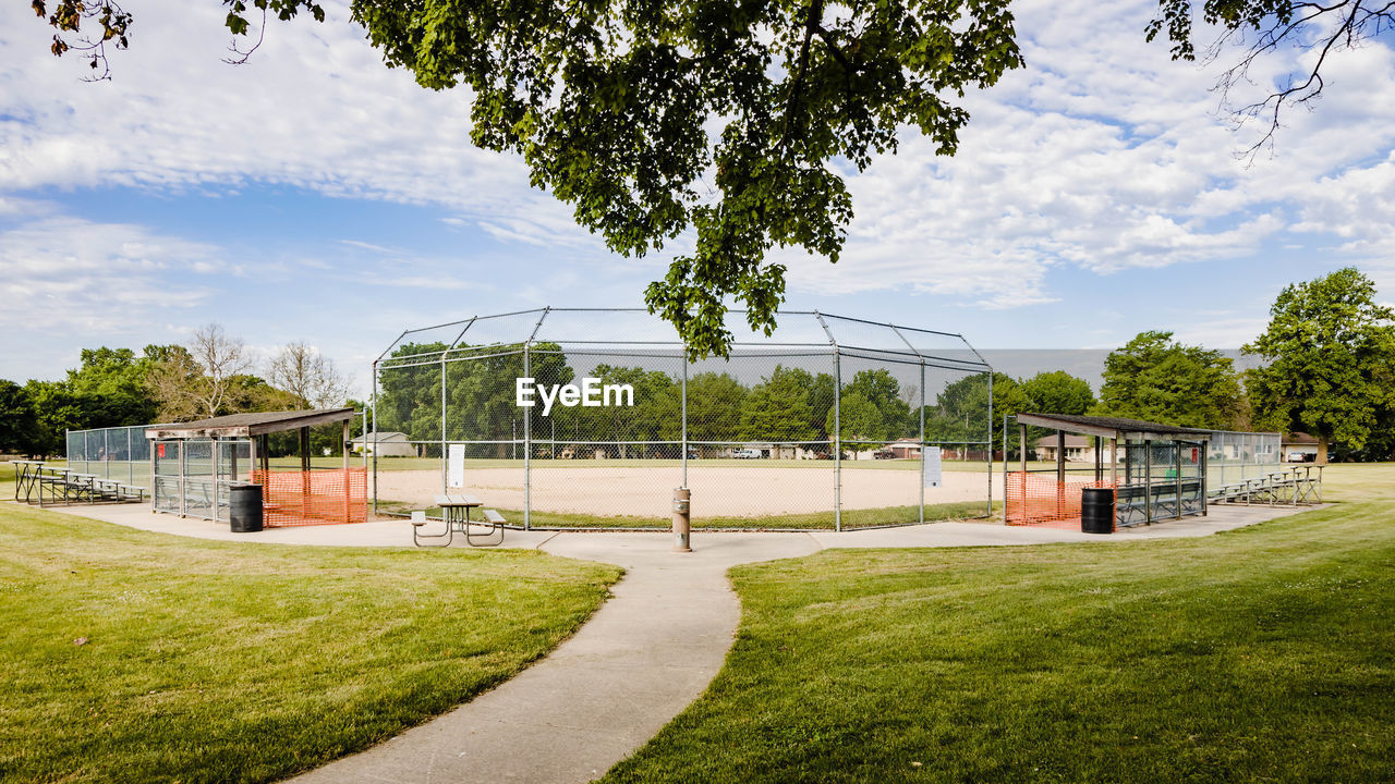 A view of a youth baseball field in a city park