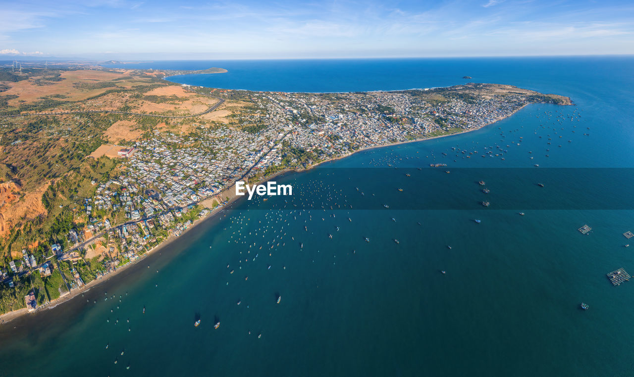 High angle view of sea shore against sky