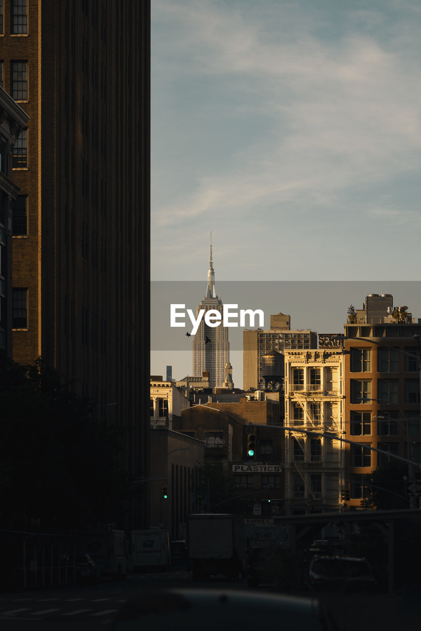 Tribeca, new york city in a cloak from the loom of the sun

building in background