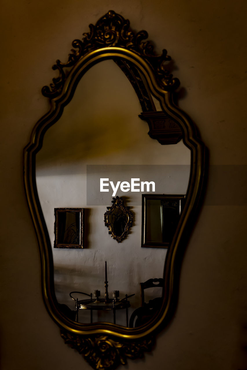 Mirror against wall at home