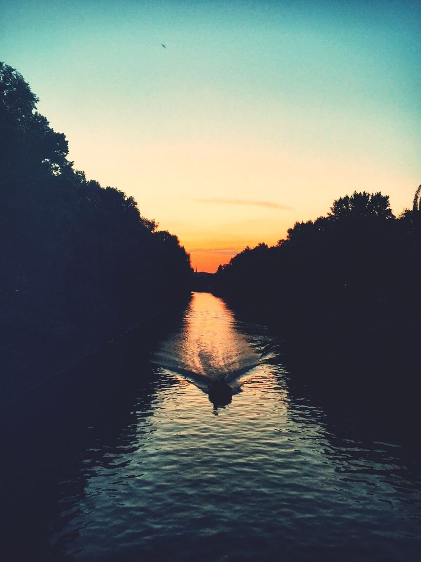 SCENIC VIEW OF LAKE AT SUNSET