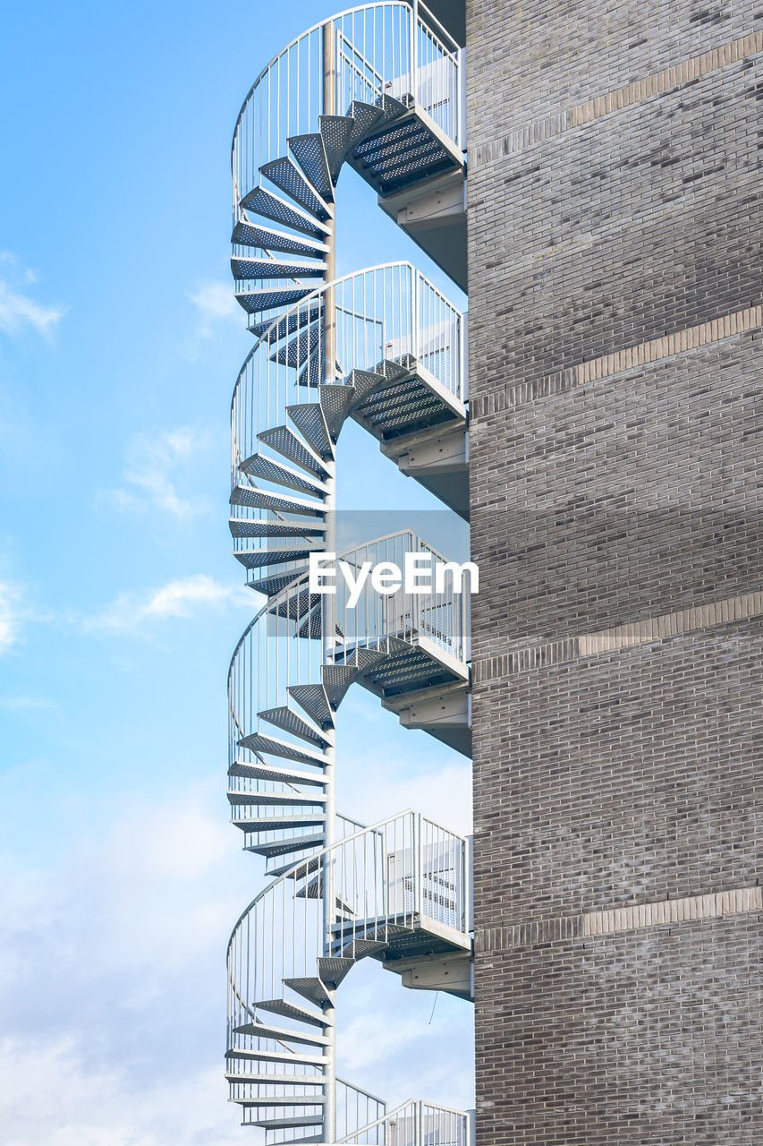 Spiral staircase on the edge of an apartment building