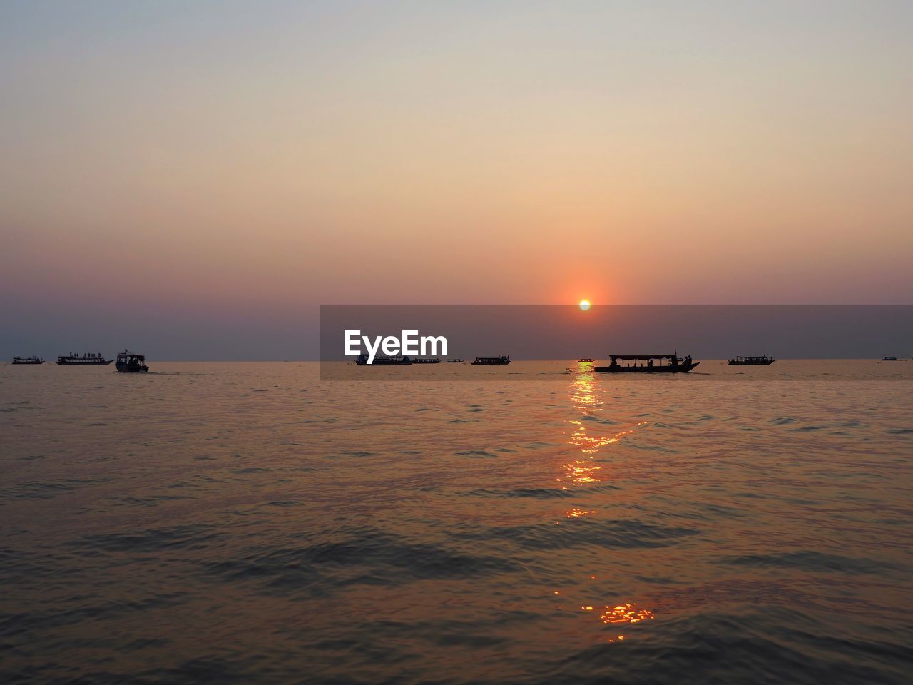 SCENIC VIEW OF SEA DURING SUNSET