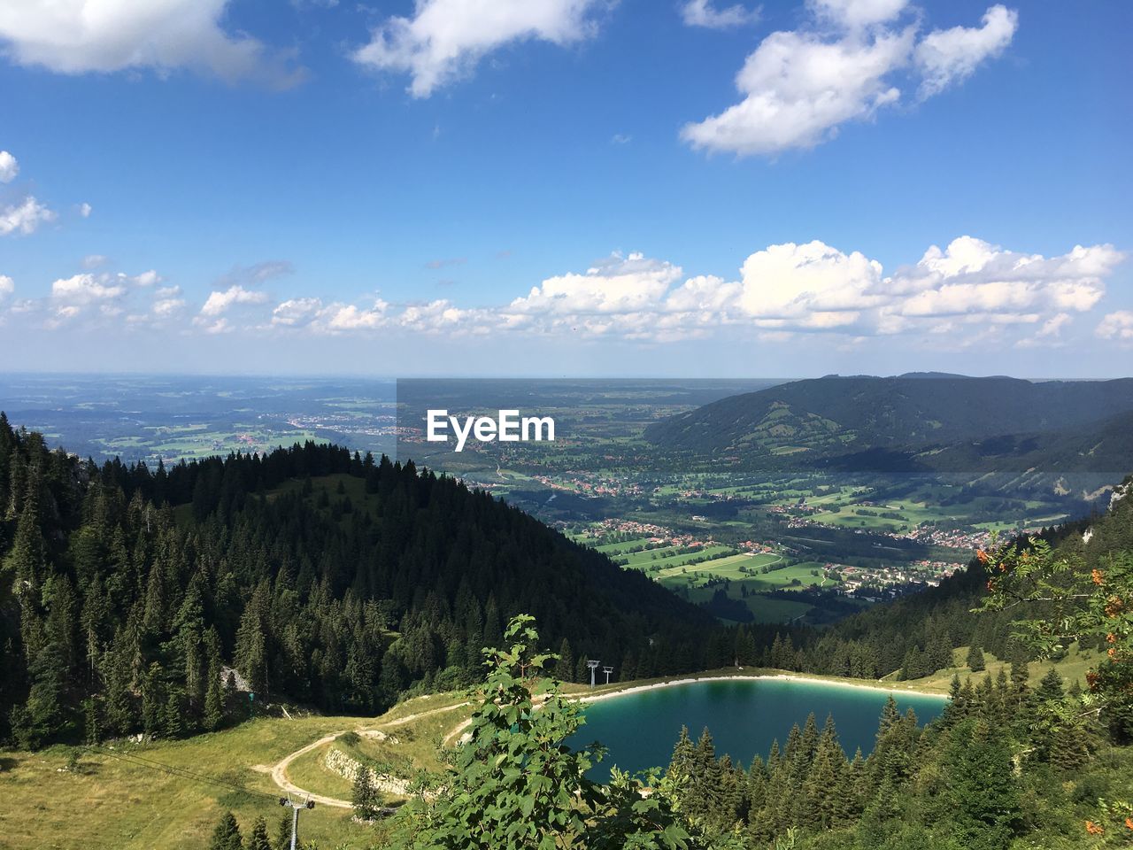 Scenic view of mountains by landscape against sky