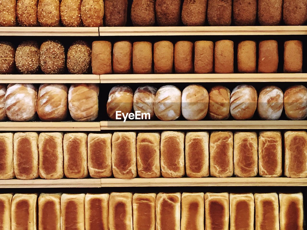 Full frame shot of breads in shelf for sale at shop