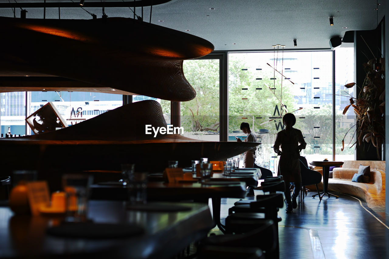 GROUP OF PEOPLE IN RESTAURANT