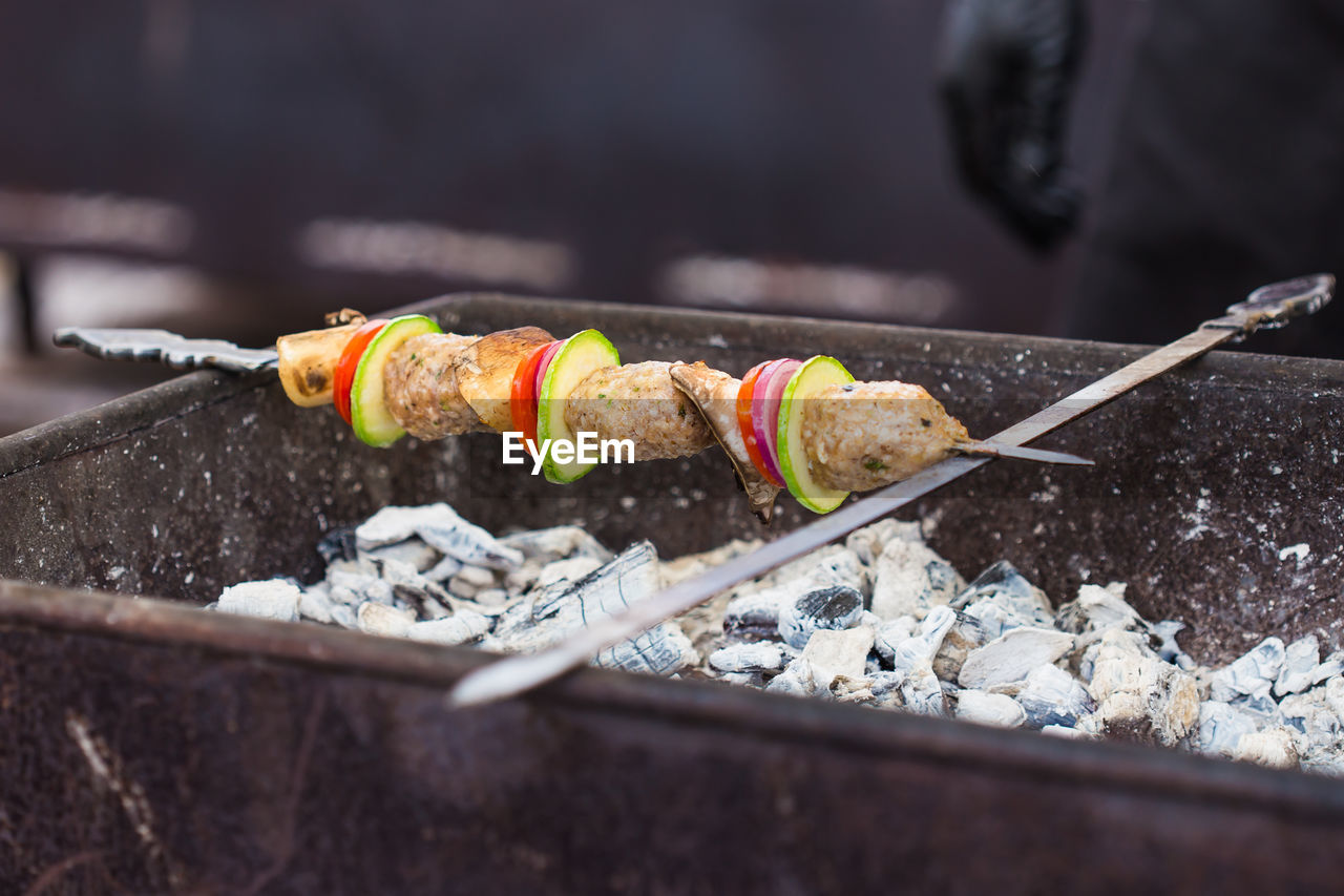 CLOSE-UP OF SEAFOOD ON BARBECUE GRILL