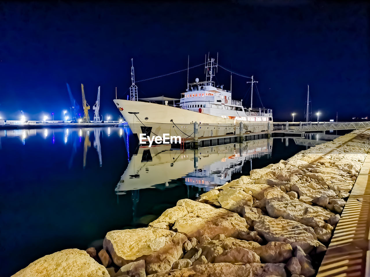 water, nautical vessel, transportation, ship, sea, vehicle, harbor, mode of transportation, nature, night, pier, reflection, dock, sky, no people, boat, watercraft, moored, outdoors, architecture, marina, industry, ocean
