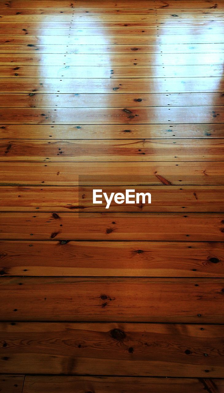 CLOSE-UP OF WOODEN PLANKS ON WOODEN FLOOR