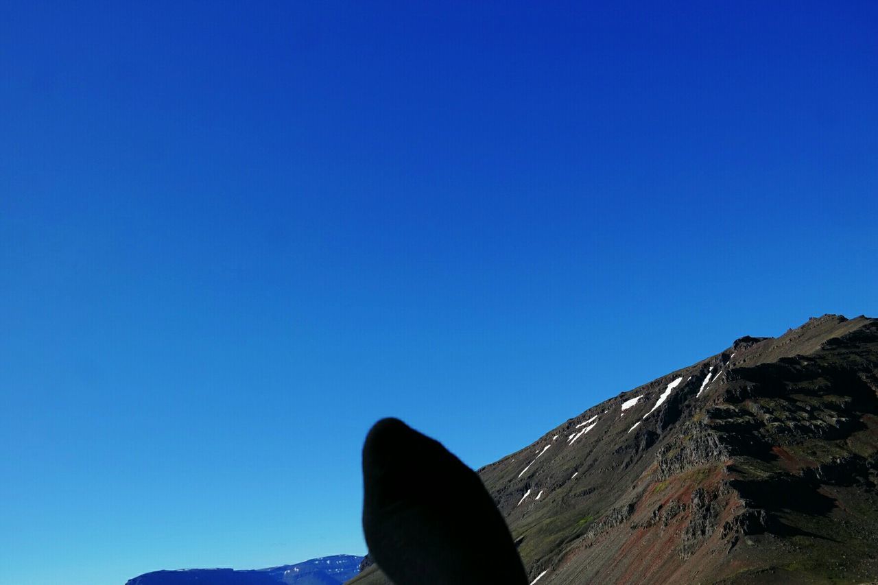 SCENIC VIEW OF MOUNTAINS AGAINST CLEAR SKY